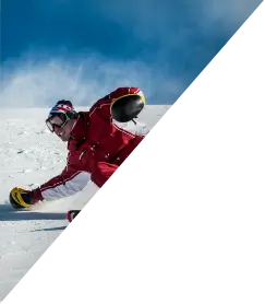 Triangle image of a man skiing in Alberta mountains.